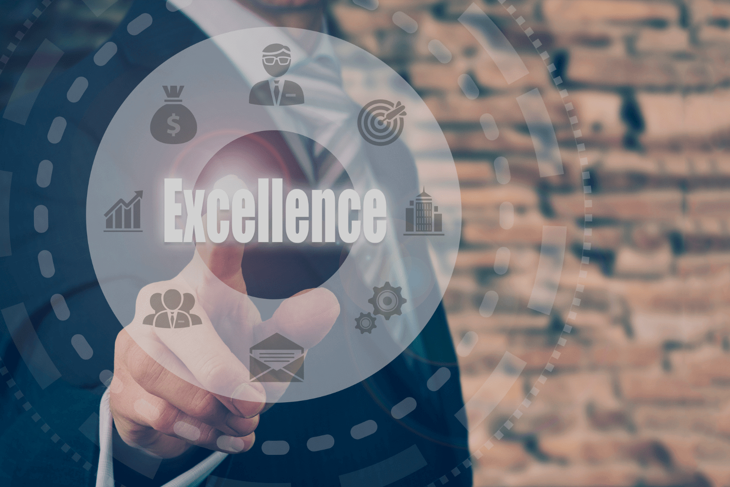 A person in a suit interacts with a futuristic virtual interface displaying icons related to business elements. The central word “Excellence” stands out, surrounded by digital lines and circles. The background features blurred brick walls and ambient lighting